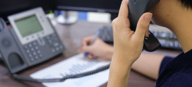 man talking to insurance company